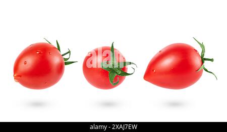 Set of falling tomatoes isolated with clipping path. Full depth Stock Photo