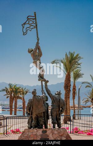 The monument is dedicated to Israel victory in the War for Independence. Men rising israeli flag Stock Photo