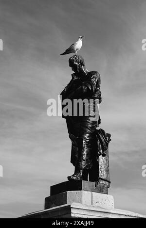 Meditative Ovid statue with seagull on his head in the Ovid Square, Old Town of ancient Tomis, Constanta city, Romania Stock Photo