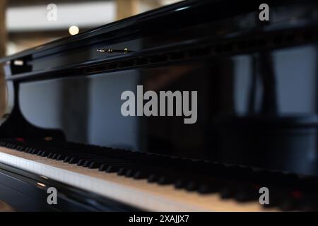 Elegant Yamaha grand piano with a focus on its glossy keys Stock Photo