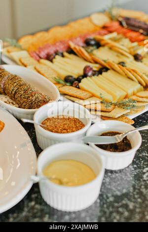 Meat, cheese, dips and appetizer display at event Stock Photo