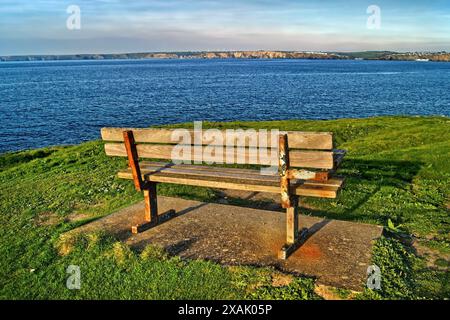 UK, Cornwall, Newquay, Bench overlooking Newquay Bay. Stock Photo