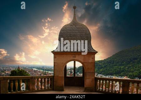 View of a castle or palace ruin in the evening at sunset. This place is located in a river valley of the Neckar, surrounded by hills. Heidelberg, Baden-Württemberg, Germany Stock Photo