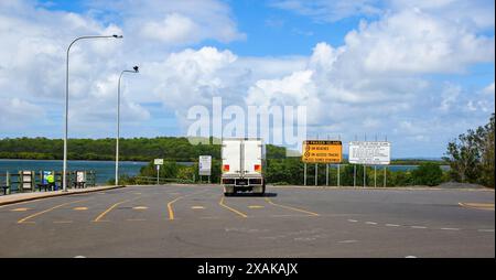 Car lanes at the Bingham port in Rivers Head, where vehicles wait to embark on the Kingfisher Bay Ferry to Fraser Island (K'gari) on the east coast of Stock Photo