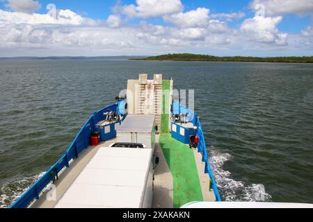 Kingfisher Bay ferry navigating towards Fraser Island (K'gari) with passengers and vehicles in Queensland, Australia Stock Photo