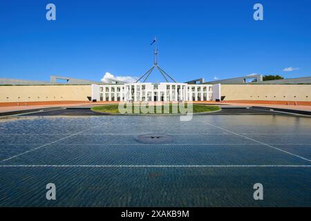 Shallow circular pond in front of the Parliament House of Australia on Capital Hill in Canberra, Australian Capital Territory Stock Photo