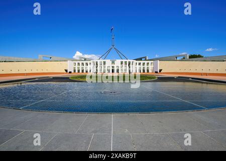 Shallow circular pond in front of the Parliament House of Australia on Capital Hill in Canberra, Australian Capital Territory Stock Photo