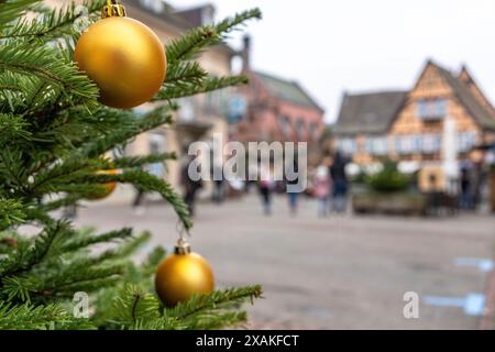 Europe, France, Grand Est, Alsace, Eguisheim, Christmas baubles on a Christmas tree in front of the Place du Chateau Stock Photo