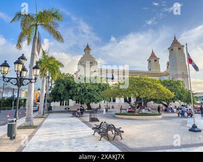 North America, Caribbean, Greater Antilles, Hispaniola Island, Dominican Republic, Puerto Plata Province, Puerto Plata, Parque Central Independencia with Catedral de San Felipe Apostol Stock Photo