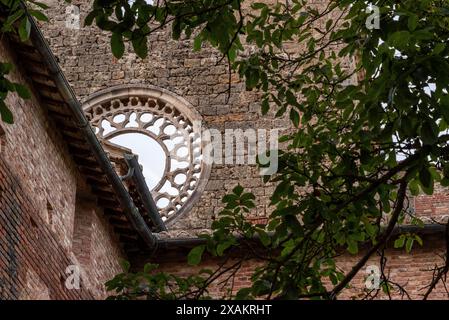 Destroyed window rosette at the abandoned Cistercian monastery San Galgano in the Tuscany, Italy Stock Photo