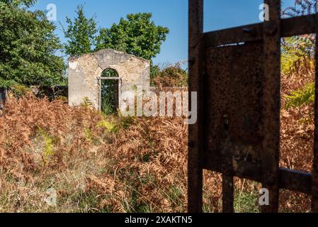 A small derelict cemetery near the Cellole monastery in the beautiful landscape of the Tuscany, Italy Stock Photo