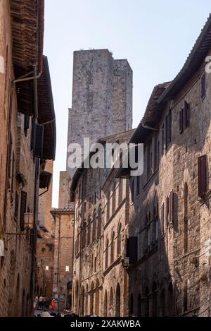 In the streets of San Gimignano, view on the towers Salvucci, Pettini and Chigi - Italy Stock Photo