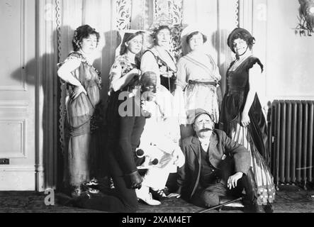 Mrs. C.H. Wright - Mrs. Chas. Ebert - Mrs. R. Beckwith - Mrs. J.M. Flagg - Mrs. H.G. Dart - C.A. Gilbert and H.G. Dart, between c1910 and c1915. Shows a costume party in New York City with Nellie (McCormick) Flagg, wife of illustrator James Montgomery Flagg and possibly artist Harry Grant Dart (1869-1938) with his wife. Stock Photo