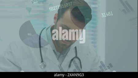 Image of statistics and data processing over caucasian male doctor making notes Stock Photo