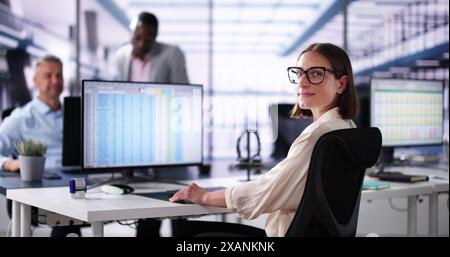 Data Analyst African Woman Using Spreadsheet On Computer Stock Photo