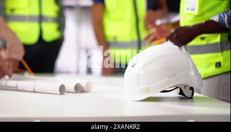 Civil Engineer Or Architect Team With Construction Plans Stock Photo