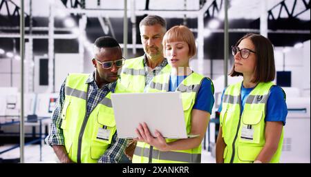 Factory Worker Osha Inspection Using Laptop Computer Stock Photo