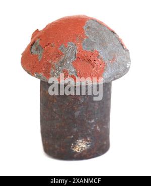 Rivet removed from the Golden Gate Bridge in San Francisco, CA during renovations performed in the '80s or '90s - orig. 'International Orange' paint Stock Photo