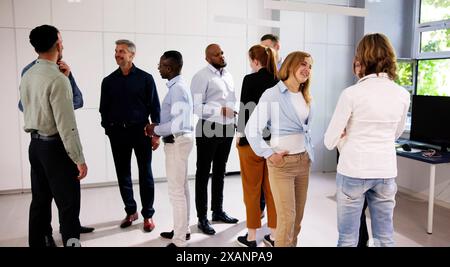 Business Communication In Office And Teamwork. Standing Meeting Stock Photo