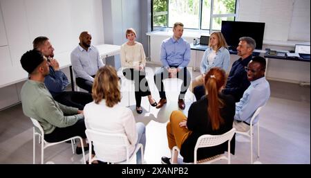 Business Communication In Office And Teamwork. Sitting Meeting Stock Photo