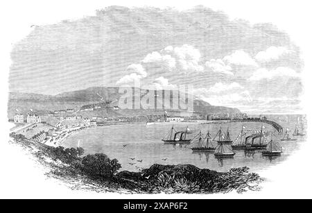 Prince Arthur's visit to the Isle of Man: Port Erin, 1869. 'The beautiful bay of Port Erin...is situated on the west side of tint island, about three miles north of the Calf of Man. It is naturally protected from winds blowing from the north, south, and east, but is exposed to the violent storms from the westward which rage in the Irish Channel during the winter months. A breakwater is new in course of construction at the entrance to the bay, which, when completed, will make Port Erin harbour the safest and most sheltered on the coast of the Isle of Man. This breakwater was designed by Mr. Joh Stock Photo