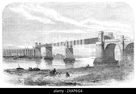 Railway bridge and viaduct at Runcorn, 1869. 'The great viaduct and bridge over the Mersey at Runcorn, which has been constructed by the London and North-Western Railway Company to shorten the distance between Liverpool and London, has been opened for public traffic. The quickest train is the ten a.m., which does the journey to Liverpool in five hours and ten minutes...The Runcorn viaduct was planned by Mr. William Baker, engineer to the Company. The whole length of the viaduct and bridge is a mile and a half. The bridge - a wrought- iron open lattice girder - consists of three openings of 305 Stock Photo