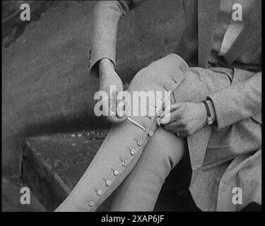 Female Civilian Using a Button Hook to Button up Her Leather Boots, 1920s. From &quot;Time to Remember - Teenage Flapper&quot;, 1920s (Reel 3); a dcumentary about women's lives in the 1920s - great commentary by Joyce Grenfell. Stock Photo