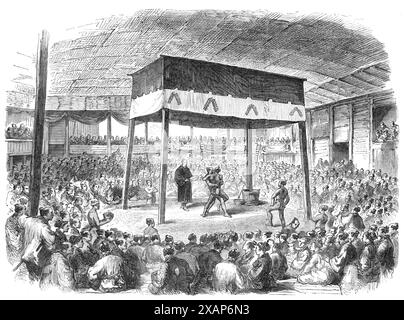 Sketches from Japan: wrestling at Osaka, 1868. Engraving of a sketch by '...our Correspondent in Japan, Mr. C. Wirgman, showing '...an enormous mat shed, filled with people. In the centre is a raised mound of earth, forming a platform under a canopy. There is a bucket of water'...a wooden ladle, and a little basket of salt. The contending performers begin the operation by going to the bucket of water, and rinsing their mouths; then they take a pinch of salt, and rub it under their arms and on their chests to purify themselves. After these ceremonies, they advance and squat down opposite each o Stock Photo