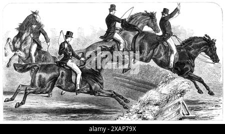 The Horse-Show at the Agricultural Hall Islington [in London]: trying the hunters, 1868. 'The leading horse at the leap is Captain Heygate's Mountain Dew, which won the &#xa3;80 first prize for heavy-weight hunters. To left hand of Mountain Dew is the Prince of Wales's Knight of St. Patrick, to which the &#xa3;25 second prize for hunters was awarded. The third horse, shown in the foreground, is Mr. Hornby's Lady Derwent, which gained the &#xa3;50 first prize for hunters, and gold medal as the best hunter in the show. Another is rearing behind...The award in favour of Mountain Dew was rather di Stock Photo