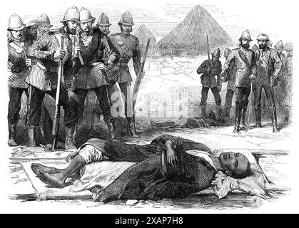 The War in Abyssinia: King Theodore, as he lay dead at Magdala, April 13, 1868. Engraving of a sketch by Major H. A. Leveson. 'Theodore [Emperor Tewodros II, had] retired within [the fortress of] Magdala, and there awaited the advance of the British...Theodore, who had already dropped his Royal robe of silk to escape observation, fled from the gateway to a retired spot higher up on the citadel...after a desperate resistance, when the British troops forced their way into the fortress, [he] shot himself, putting the pistol into his mouth...His dead body was found...alone on the hill above...From Stock Photo