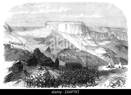 The War in Abyssinia: the 33rd Foot advancing upon Magdala, from below Islamgee, 1868. Engraving of a sketch by Major H. A. Leveson [of the British Army], '...of the flat-topped hill and fortress of Magdala, taken by himself from the bottom of the ascent to Islamgee. The distance, in a straight line through the air, from this point of view to the rocky summit upon which was the assemblage of huts, inclosed with a palisade, called by the name of Magdala, is about one mile; but the distance to be actually climbed is much greater, A column of the 33rd Foot is shown in the foreground, advancing to Stock Photo