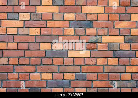 Background from a wall of dark red clinker bricks Stock Photo