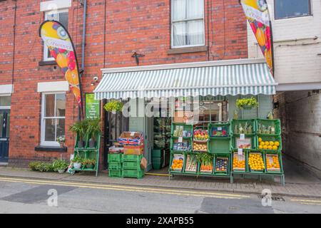 Fresh fruit and vegetable on display outside the  Dee Valley Fruit & Veg Wholesale & Retail shop in Welsh town of Llangollen. Stock Photo