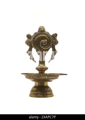 an old antique oil lamp holder made of brass metal isolated on white background Stock Photo