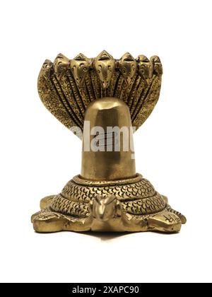 antique statue of lord shiva lingam on a turtle called kurma protected by a snake, a idol worshipped by hindu religious worshippers isolated Stock Photo