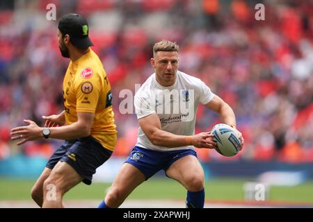 London, UK. 08th June, 2024. George Williams of Warrington Wolves warms up during the Challenge Cup Final match between Warrington Wolves and Wigan Warriors at Wembley Stadium, London, England on 8 June 2024. Photo by Ken Sparks. Editorial use only, license required for commercial use. No use in betting, games or a single club/league/player publications. Credit: UK Sports Pics Ltd/Alamy Live News Stock Photo