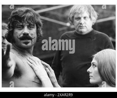 OLIVER REED, KEN RUSSELL and VANESSA REDGRAVE filming a scene for THE DEVILS 1971 Director KEN RUSSELL Novel ALDOUS HUXLEY Production Design DEREK JARMAN  Costume Design SHIRLEY RUSSELL  Russo Productions / Warner Brothers Stock Photo