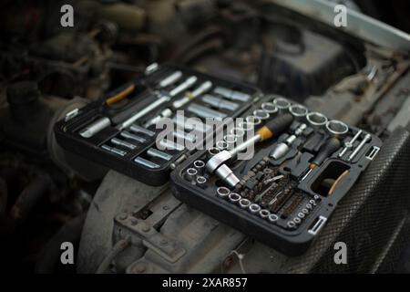 Tool box. Repair keys. Heads for unscrewing nuts. Repair kit. Chrome-plated steel. Drawer with bolts. Stock Photo