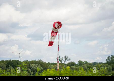 Wind Direction Indicator, Windsock, windsock, or wind cone on small plane landing strip, Schinveld, Netherlands. Stock Photo