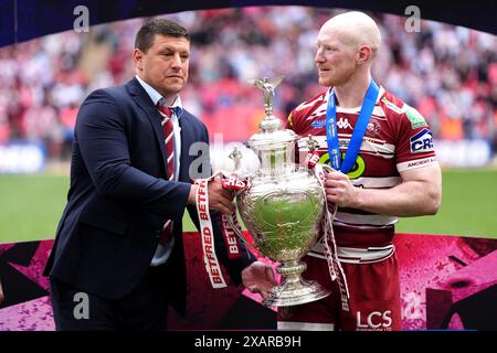 Wigan Warriors head coach Matt Peet (left) celebrates with player Liam Farrell after the final whistle in the Betfred Challenge Cup final at Wembley Stadium, London. Picture date: Saturday June 8, 2024. Stock Photo