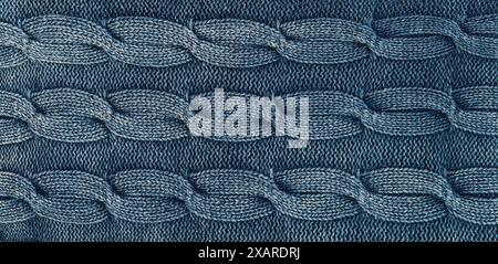 Close-up of blue knitted fabric with twists Stock Photo