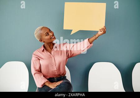 Mockup, speech bubble and smile with business black woman in waiting room for human resources interview. Advertising, blue background or marketing and Stock Photo