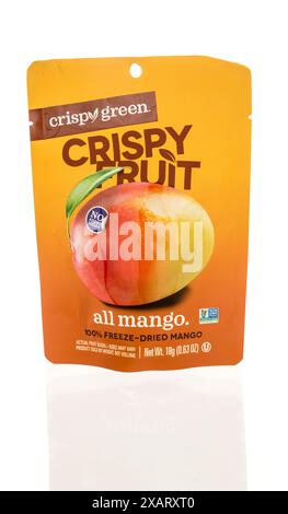 Winneconne, WI - 27 April 2024: A package of Crispy green crispy fruit all mango freeze dried snack on an isolated background. Stock Photo