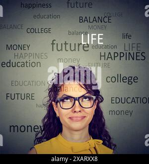 Young woman thinking contemplating about future life Stock Photo