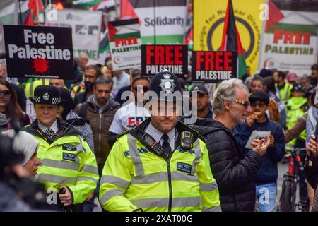 London, UK. 08th June, 2024. Police officers walk ahead of protesters during the demonstration in Russell Square. Thousands of people marched in solidarity with Palestine demanding a ceasefire as Israel continues its attacks on Gaza. Credit: SOPA Images Limited/Alamy Live News Stock Photo