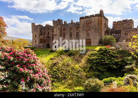 Muncaster Castle, a Medieval castle, home of the Frost Pennington family, viewed from the gardens, Ravenglass, Cumbria, Lake District, England, UK. Stock Photo