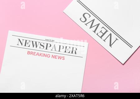 Blank newspapers on pink background Stock Photo