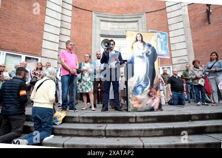 Madrid, Kingdom of Spain; 06/08/2024.- A hundred people pray the Catholic Rosary on Ferraz Street in Madrid, where the headquarters of the Spanish Socialist Workers Party (PSOE) is located. The Superior Court of Justice of Madrid (TSJM) authorized a rally to pray the rosary in front of the PSOE headquarters on Ferraz Street in the capital during the day of reflection and on Sunday itself, when the European elections are held. The authorization of the rosary in Ferraz on the day of reflection: a ruling that corrects the Electoral Board with a speaker who was a senior official of the PP. The s Stock Photo