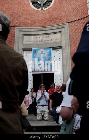 Madrid, Kingdom of Spain; 06/08/2024.- A hundred people pray the Catholic Rosary on Ferraz Street in Madrid, where the headquarters of the Spanish Socialist Workers Party (PSOE) is located. The Superior Court of Justice of Madrid (TSJM) authorized a rally to pray the rosary in front of the PSOE headquarters on Ferraz Street in the capital during the day of reflection and on Sunday itself, when the European elections are held. The authorization of the rosary in Ferraz on the day of reflection: a ruling that corrects the Electoral Board with a speaker who was a senior official of the PP. The s Stock Photo