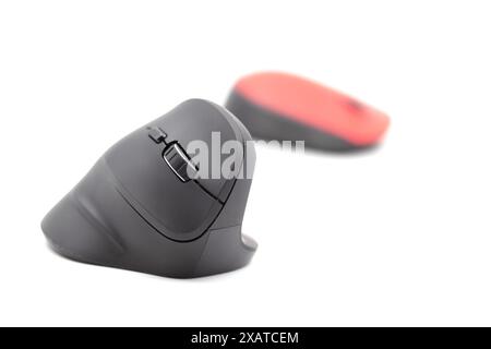 Vertical black and horizontal red computer mouse on a white background against each other. Horizontal. Background. Template. Photo in high quality Stock Photo